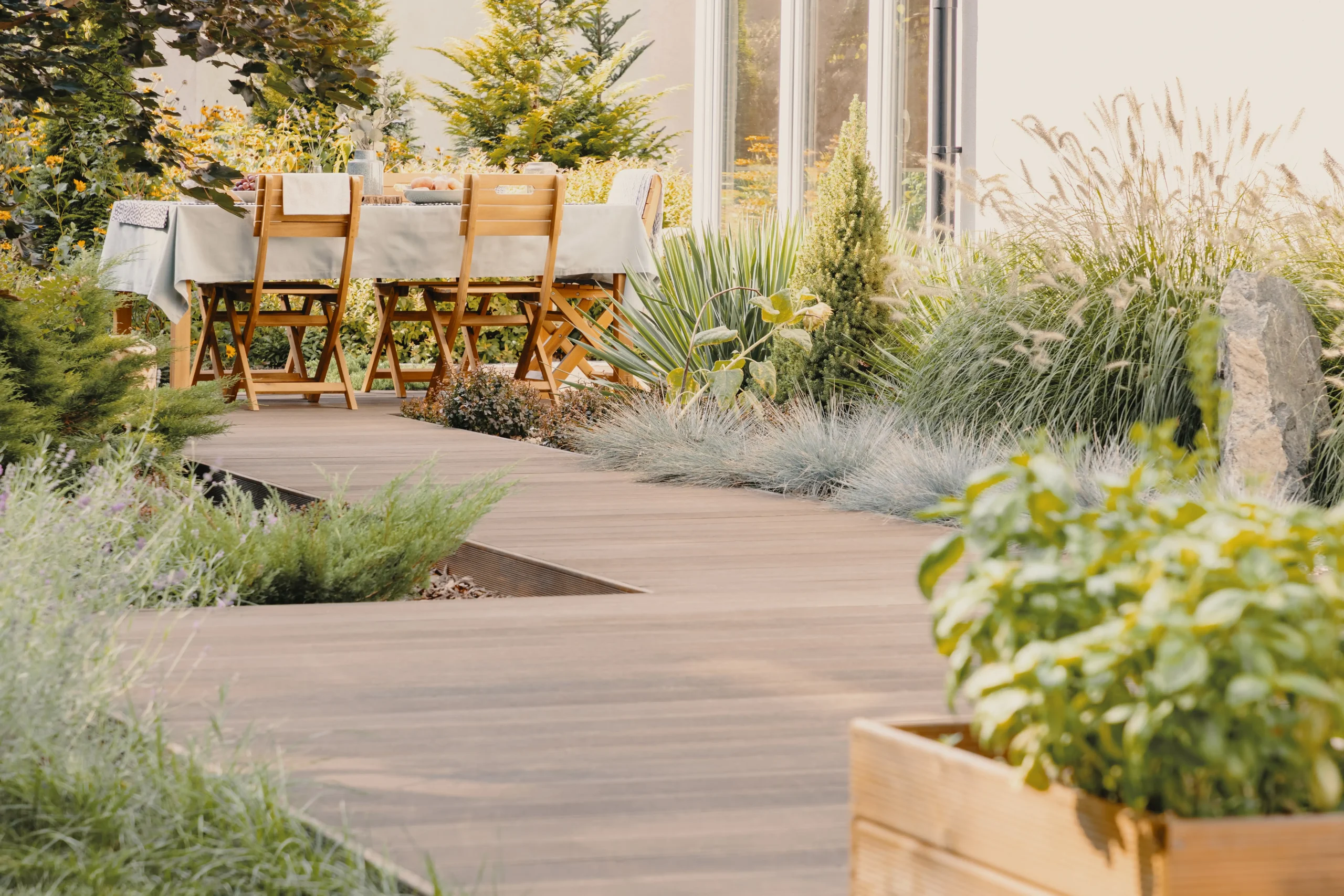 plants-and-wooden-chairs-at-table-with-food-on-ter-2024-10-18-10-12-07-utc